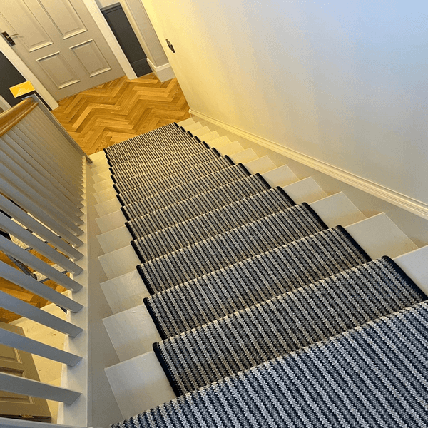 Stair runner fitting by First Choice Flooring.